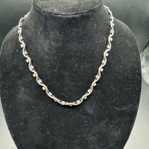 Elegant Silver  Women's Necklace with blue and opalescent stones.